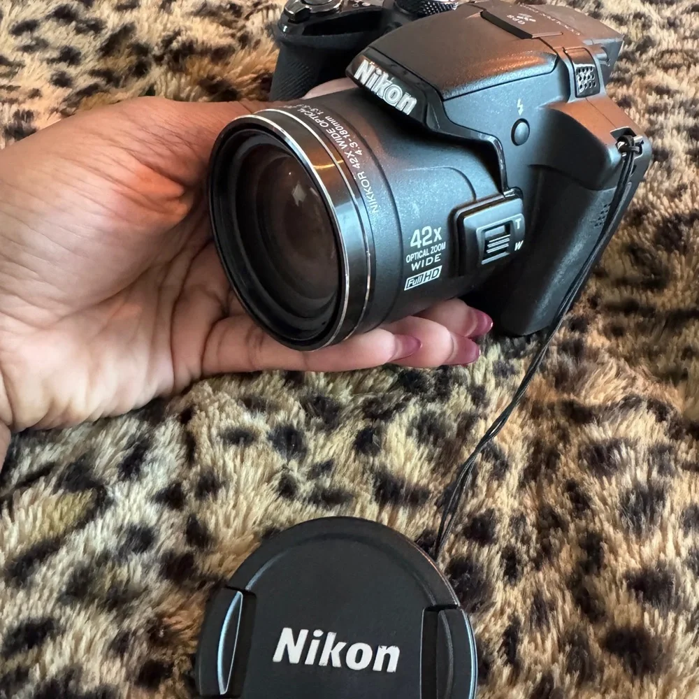 Nikon Black Camera with White Accessories